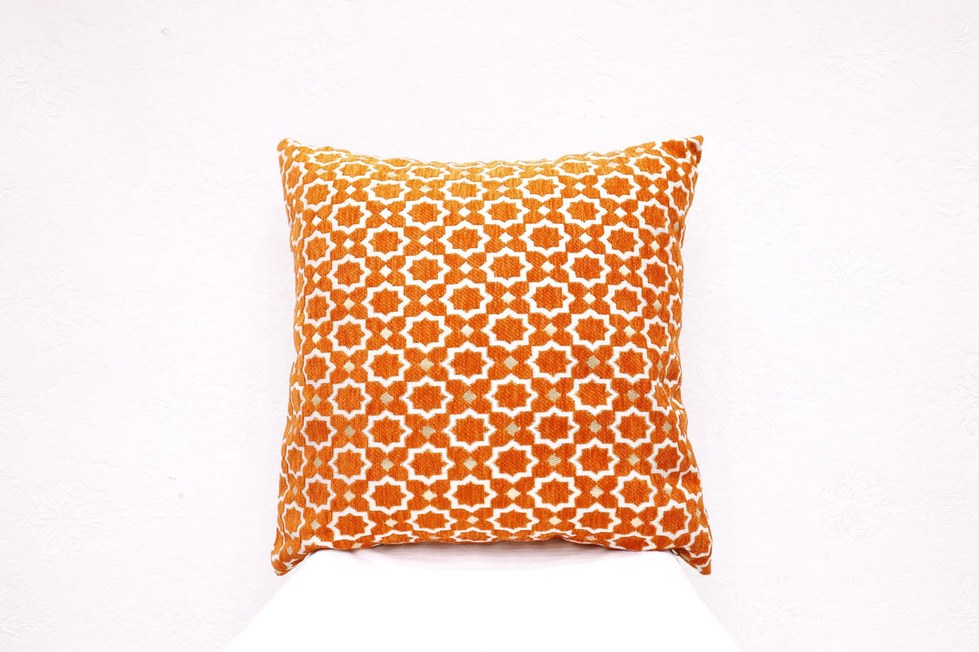 Handcrafted ethnic cushion cover on a sofa