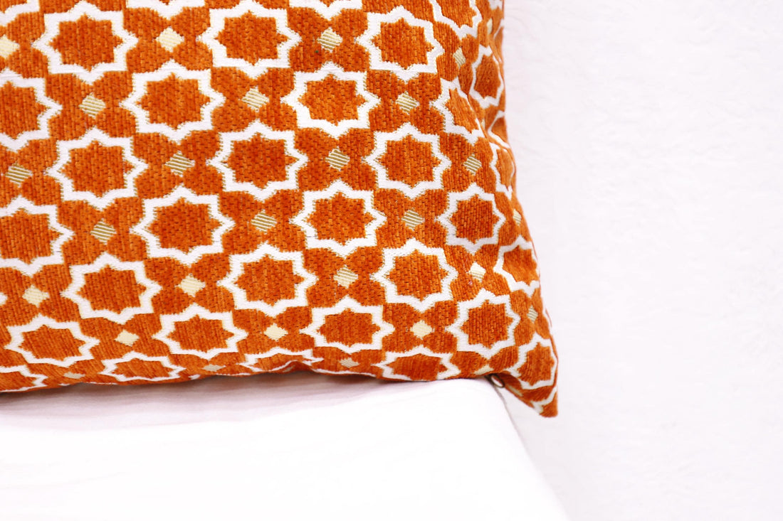 Artisan Moroccan throw pillow with vibrant patterns.
