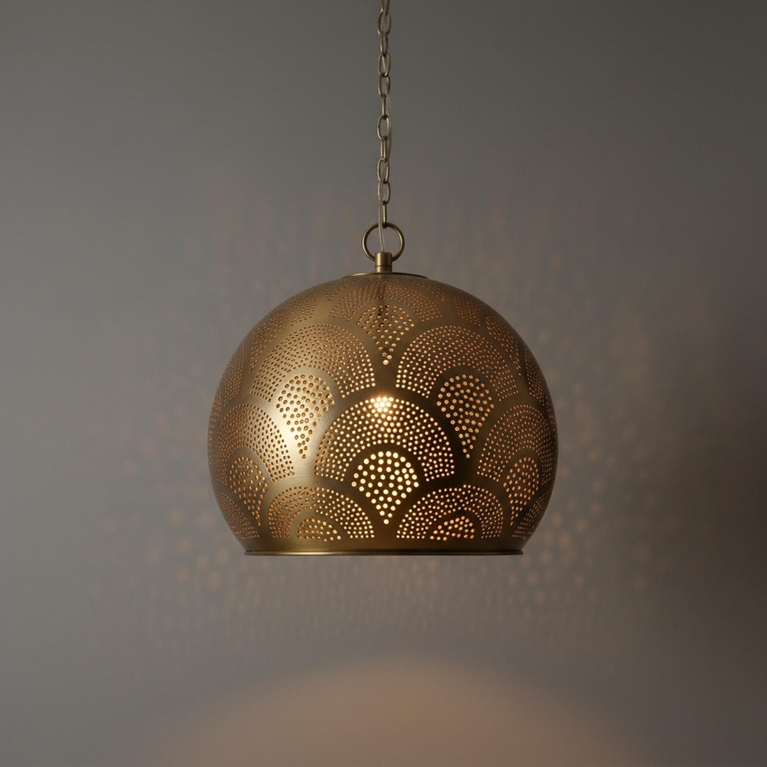 brass globe pendant light perforated patterned hanging chain lamp