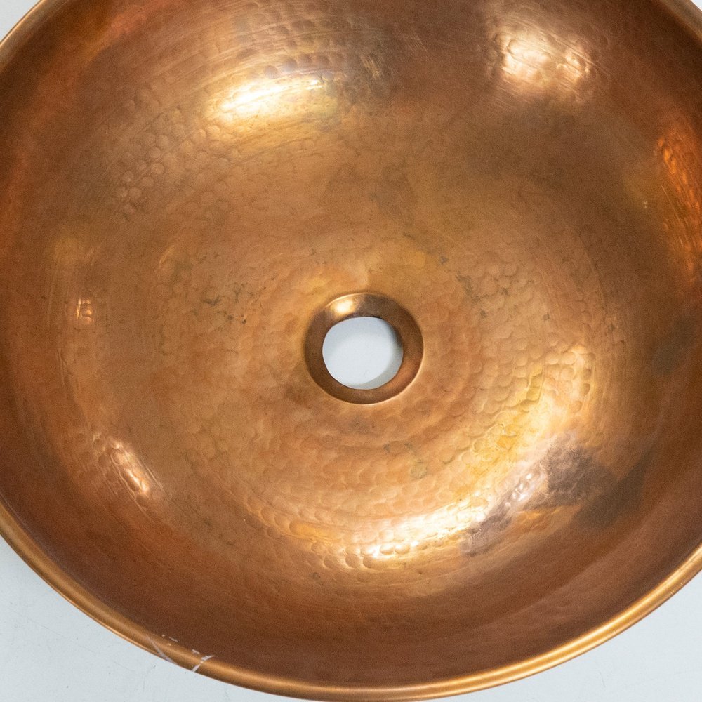 copper vessel sink basin and wood base for rustic and modern bathroom decor