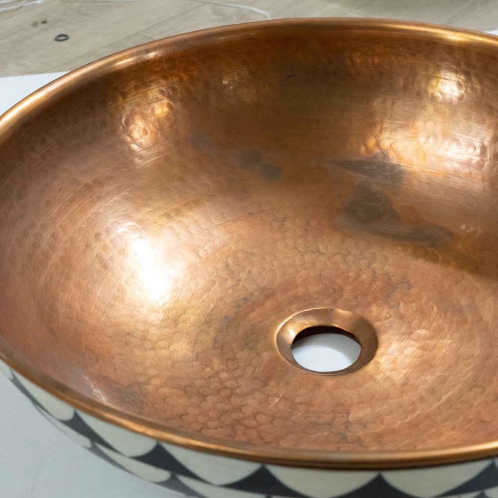 copper vessel sink basin and wood base for rustic and modern bathroom decor